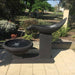 Single Wave Fountain Charcoal front view at the greenery