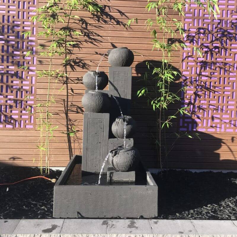 Streaming Pots Fountain with bamboo trees surround