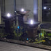 Triple Bowl Fountain Charcoal at night with lights on
