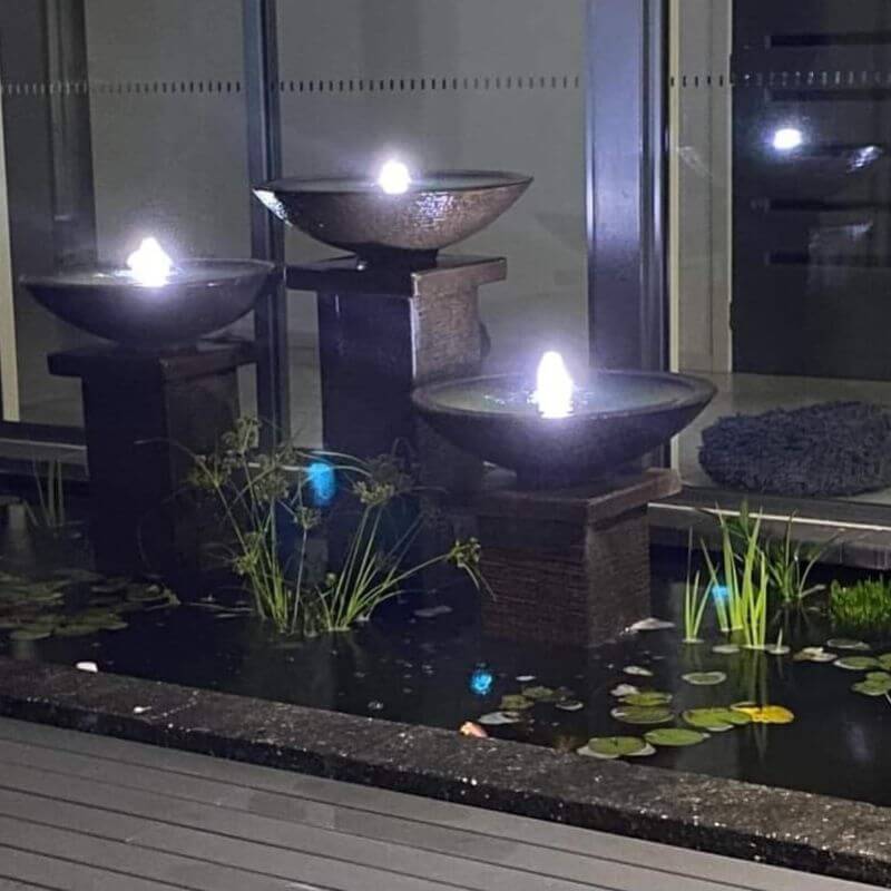 Triple Bowl Fountain Charcoal at night with lights on