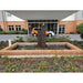Twin Column Fountain rust in square pond front building