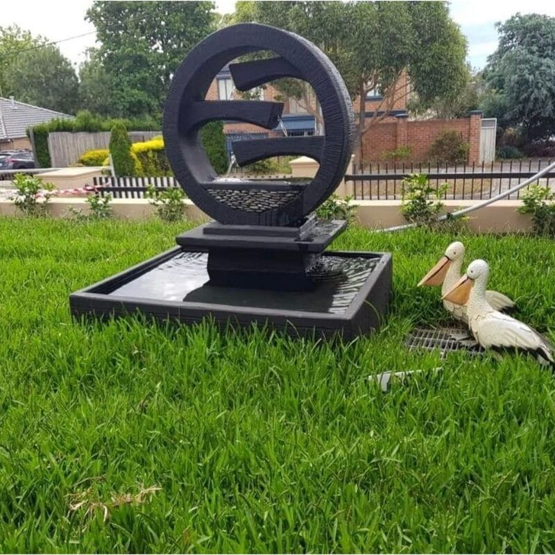 Wagon Wheel Fountain Medium charcoal at lawn area