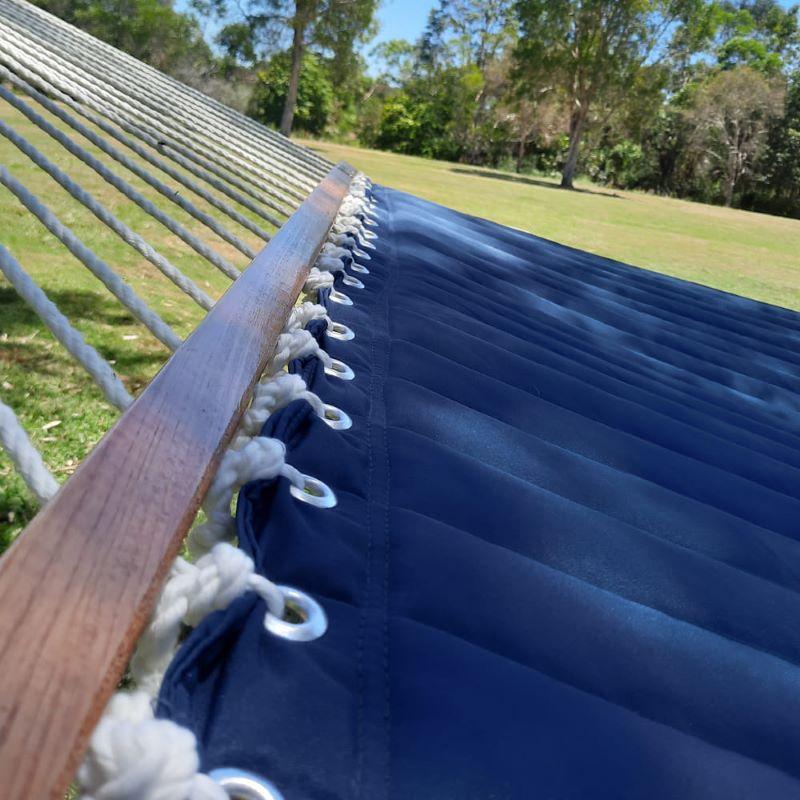 Quilted Hammock in Navy Blue close up of spreader bar