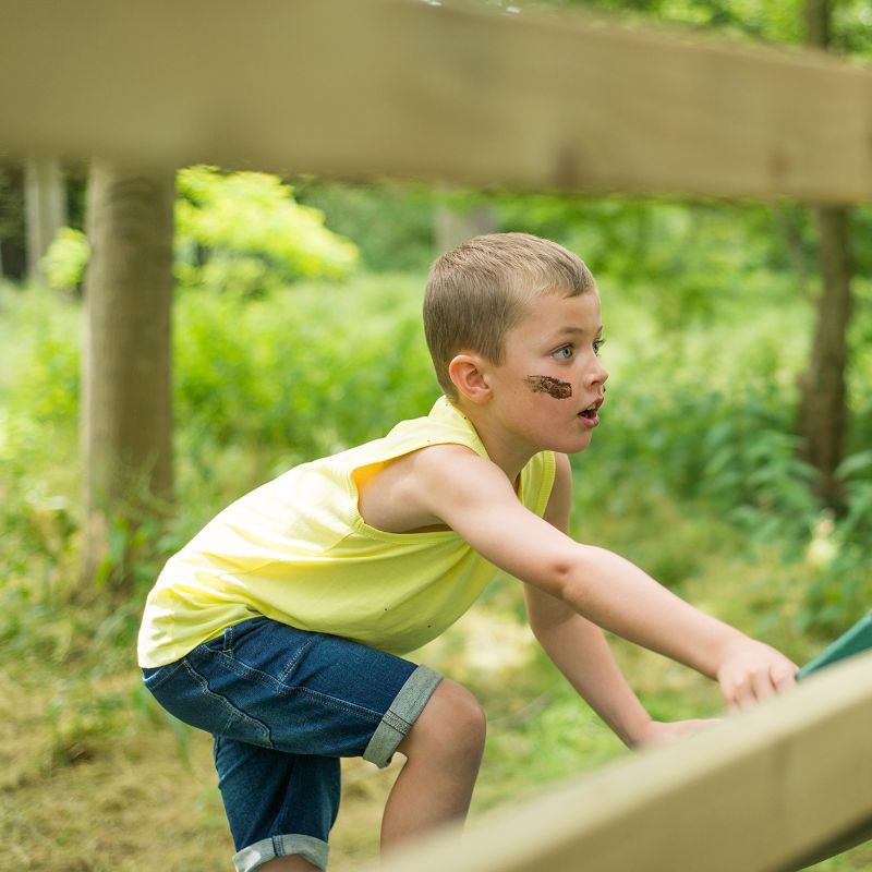 Wooden Climbing Cube with slide kid on the slid