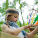 Wooden Climbing Cube with slide  Girl playing with a bow and arrow