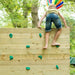 Wooden Climbing Cube with slide Boy on top of the climbing wall