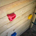 Wooden Lookout tower focus on the climbing holds