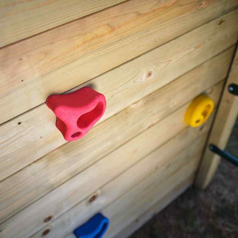 Wooden Lookout tower focus on the climbing holds