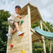 Boy on the top of the Wooden Lookout Tower with Slide