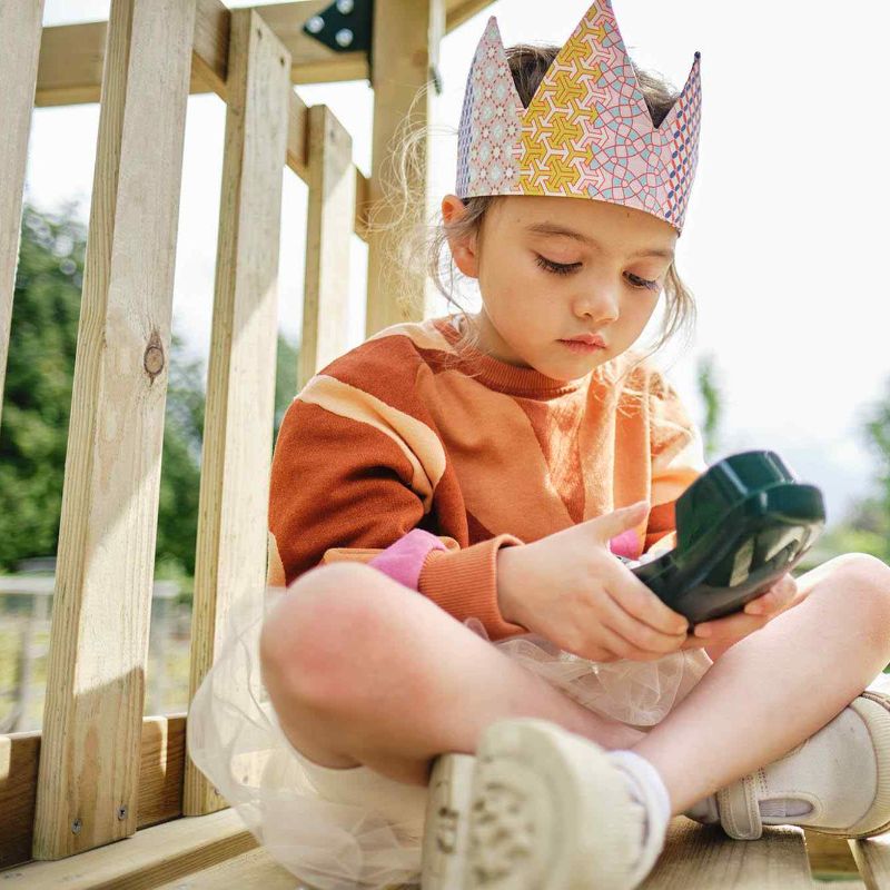 Wooden Lookout Tower Girl holding a phone while on top of tower