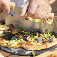 ZiiPa Pozzello Rocking Pizza Cutter on pizza