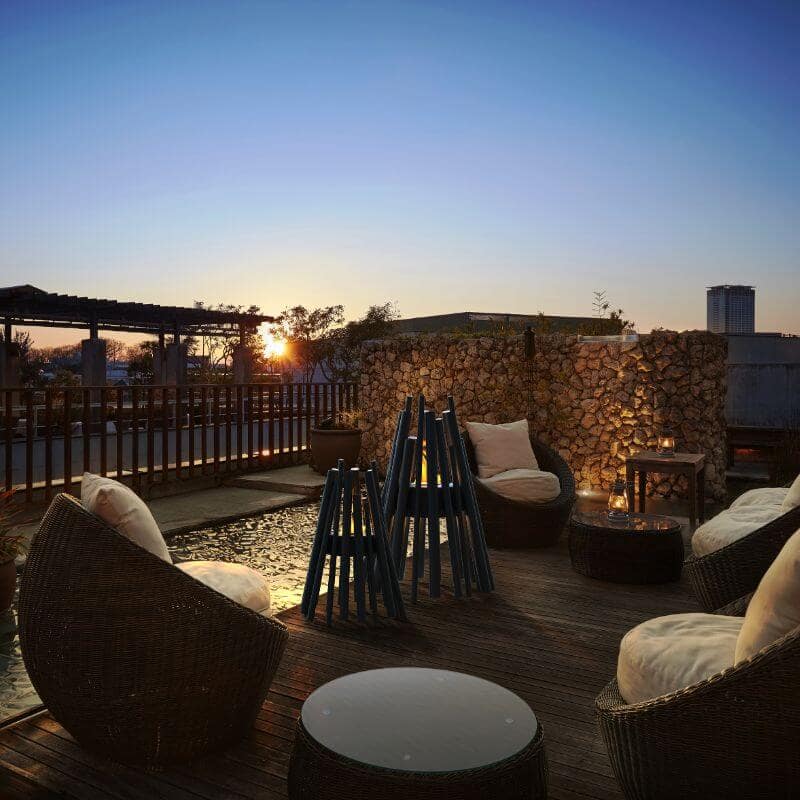 Ecosmart fire stix and Fire stix 8 at outdoor lounge with sunset