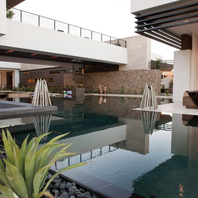 Ecosmart Fire stix stainless steel beside the pool